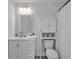 Clean bathroom with white vanity, mirror, and shower at 12020 82Nd E St, Parrish, FL 34219