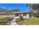 Newly renovated home with a modern facade and landscaped front yard at 12020 82Nd E St, Parrish, FL 34219