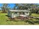 Newly renovated home with a modern facade and landscaped front yard at 12020 82Nd E St, Parrish, FL 34219