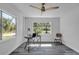 Home office with hardwood floors and large windows providing natural light at 12020 82Nd E St, Parrish, FL 34219