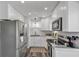 Modern kitchen with stainless steel appliances and white cabinets at 12020 82Nd E St, Parrish, FL 34219