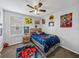 bedroom with super hero bedding and rug at 8720 Savory Walk Dr, Land O Lakes, FL 34637