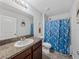 Bathroom with shower/tub combo, granite vanity, and shark theme at 8720 Savory Walk Dr, Land O Lakes, FL 34637