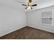 Bright bedroom with ceiling fan, neutral walls, and brown carpet at 8720 Savory Walk Dr, Land O Lakes, FL 34637