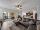 Spacious living room with sectional sofa and kitchen views at 8720 Savory Walk Dr, Land O Lakes, FL 34637