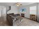 Relaxing living room featuring a sectional sofa and a large TV at 8720 Savory Walk Dr, Land O Lakes, FL 34637