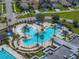 Aerial view of resort-style pool with water features and shade structures at 8720 Savory Walk Dr, Land O Lakes, FL 34637