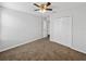Spacious bedroom with double door closet and ceiling fan at 8720 Savory Walk Dr, Land O Lakes, FL 34637