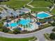 Community pool area with lap pool, leisure pool, and water features at 8720 Savory Walk Dr, Land O Lakes, FL 34637