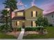 Two story home with landscaped yard and walkway at 8720 Savory Walk Dr, Land O Lakes, FL 34637