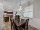 Charming dining area with a wooden table and pendant lighting at 8720 Savory Walk Dr, Land O Lakes, FL 34637