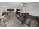 Open living space with a sectional sofa and a view into the kitchen at 8720 Savory Walk Dr, Land O Lakes, FL 34637