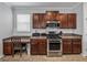 Kitchen features stainless steel appliances and a built-in desk area at 8720 Savory Walk Dr, Land O Lakes, FL 34637