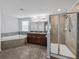 Spa-like bathroom with soaking tub and separate shower at 8720 Savory Walk Dr, Land O Lakes, FL 34637