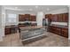 Spacious kitchen with island, stainless steel appliances, and ample cabinetry at 8720 Savory Walk Dr, Land O Lakes, FL 34637