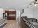 Modern kitchen with dark wood cabinets and stainless steel appliances at 8720 Savory Walk Dr, Land O Lakes, FL 34637