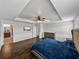 Bright bedroom featuring wood floors, and en-suite bathroom at 8720 Savory Walk Dr, Land O Lakes, FL 34637