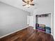 Well-lit bedroom with wood flooring, ceiling fan, and closet at 8720 Savory Walk Dr, Land O Lakes, FL 34637