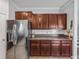 Sleek kitchen with stainless steel refrigerator and ample counter space at 8720 Savory Walk Dr, Land O Lakes, FL 34637
