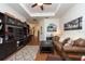 Living room features a brown couch, coffee table, and built-in shelving at 11220 Port Douglas Dr, New Port Richey, FL 34654