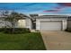 One-story house with attached garage and landscaping at 13204 Waterleaf Garden Cir, Riverview, FL 33579