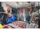 Small bedroom with hardwood floors, eclectic decor, and various items at 14180 W Parsley Dr, Madeira Beach, FL 33708