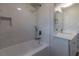 Clean bathroom featuring a bathtub, shower, and vanity at 1328 Barry St, Clearwater, FL 33756
