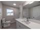 Bright bathroom with white vanity, quartz countertop, and toilet at 1328 Barry St, Clearwater, FL 33756