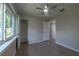 Spacious bedroom with wood-look floors, window, and closet at 1328 Barry St, Clearwater, FL 33756