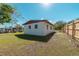 Rear view of a single-story house with a fenced yard at 1328 Barry St, Clearwater, FL 33756