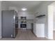Updated kitchen with stainless steel appliances and white cabinets at 1328 Barry St, Clearwater, FL 33756