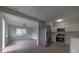 Open concept kitchen boasts stainless steel appliances and white cabinets at 1328 Barry St, Clearwater, FL 33756
