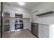Updated kitchen with stainless steel appliances and white cabinets at 1328 Barry St, Clearwater, FL 33756