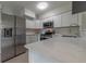 Modern kitchen features white cabinets and stainless steel appliances at 1328 Barry St, Clearwater, FL 33756
