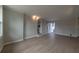 Bright living room with wood-look floors and access to kitchen at 1328 Barry St, Clearwater, FL 33756