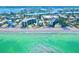 Stunning aerial view of beachfront condos with pristine sandy beach and turquoise waters at 2618 Gulf Blvd # 407, Indian Rocks Beach, FL 33785