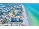 Aerial view of a beachfront condo, showcasing the beautiful coastline and ocean views at 2618 Gulf Blvd # 407, Indian Rocks Beach, FL 33785