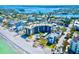 Gorgeous aerial shot featuring a beachfront condo, a swimming pool and sandy beach at 2618 Gulf Blvd # 407, Indian Rocks Beach, FL 33785