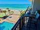 Take in beautiful ocean views from this home's balcony overlooking the pool and sandy beach at 2618 Gulf Blvd # 407, Indian Rocks Beach, FL 33785