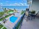 Relaxing balcony view overlooking a pool, gazebo and ocean at 2618 Gulf Blvd # 407, Indian Rocks Beach, FL 33785