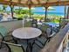 Outdoor kitchen with dining area and beach access at 2618 Gulf Blvd # 407, Indian Rocks Beach, FL 33785