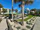 Community outdoor kitchen and lounge area with beach access at 2618 Gulf Blvd # 407, Indian Rocks Beach, FL 33785