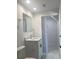 Modern bathroom boasts new vanity, toilet, shower and sleek marble floors at 4803 Guardian Ave, Holiday, FL 34690