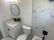 Modern bathroom featuring new vanity, toilet, tub and round mirror at 4803 Guardian Ave, Holiday, FL 34690