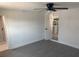 This bedroom features wood-look flooring and an open doorway to the kitchen at 4803 Guardian Ave, Holiday, FL 34690