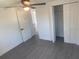 This bedroom features wood-look flooring and a double-door closet at 4803 Guardian Ave, Holiday, FL 34690