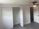 Spacious bedroom with walk-in closet, ceiling fan and gray flooring at 4803 Guardian Ave, Holiday, FL 34690