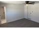 This bedroom features wood-look flooring and an ensuite bathroom at 4803 Guardian Ave, Holiday, FL 34690