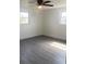 Sunny bedroom featuring gray flooring, fresh paint and an abundance of natural light at 4803 Guardian Ave, Holiday, FL 34690