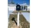 Suburban house with a neatly kept lawn and a classic mailbox, showcasing a well-maintained property at 4803 Guardian Ave, Holiday, FL 34690